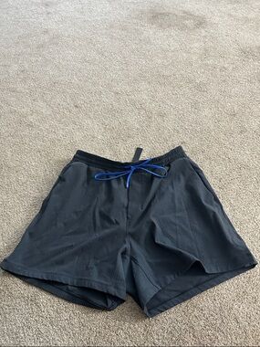 Lululemon gray men’s pool shorts  size M with Blue Drawstring .